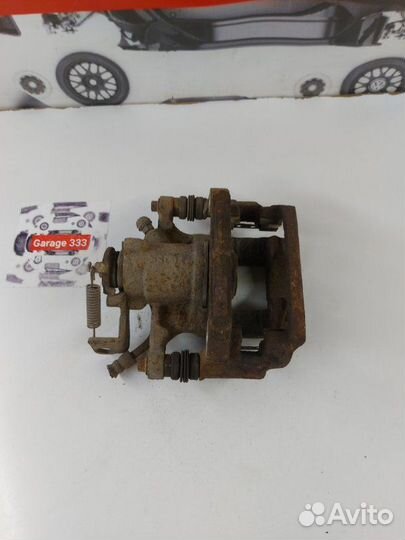 Суппорт тормозной задний левый Opel Mokka
