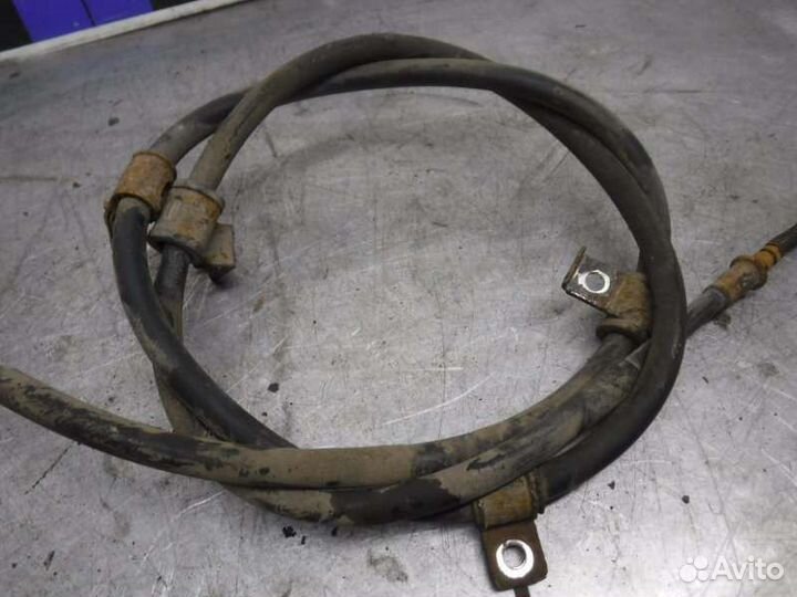 Трос ручника левый Mitsubishi Pajero Sport 2 4D56