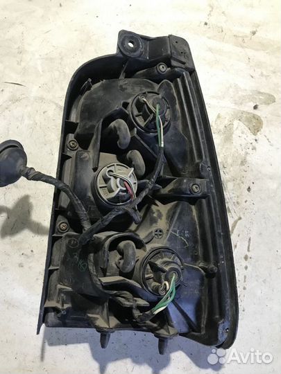 Фонарь левый Toyota Corolla 100