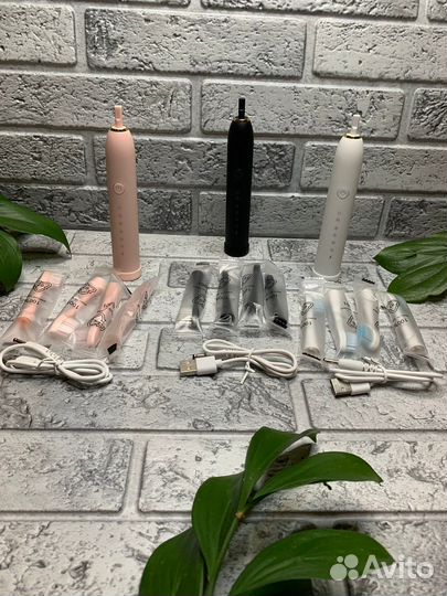 Электрическая зубная щетка