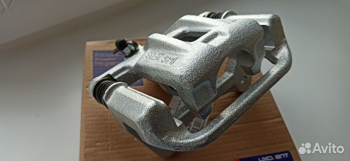 Суппорт тормозной задний левый Шевроле Лачетти