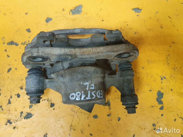 Суппорт тормозной передний левый toyota