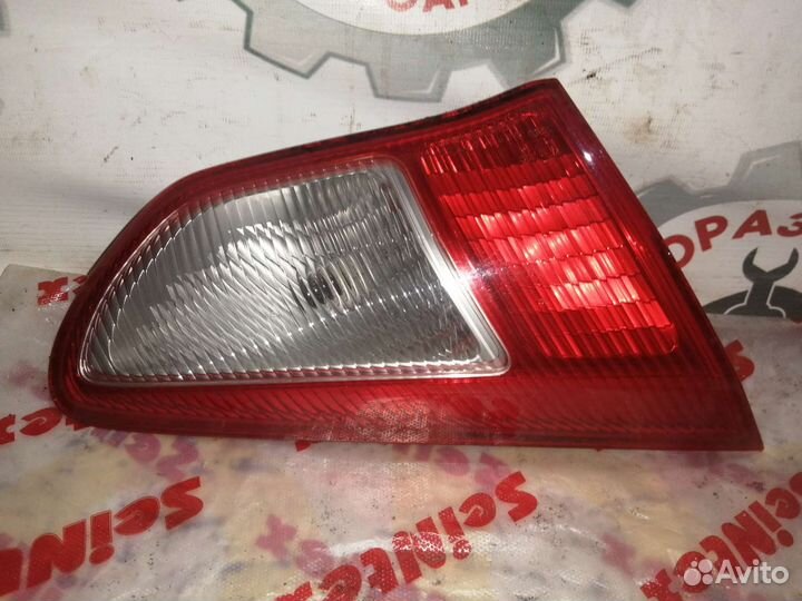 Фонарь багажника левый Mitsubishi lancer 10