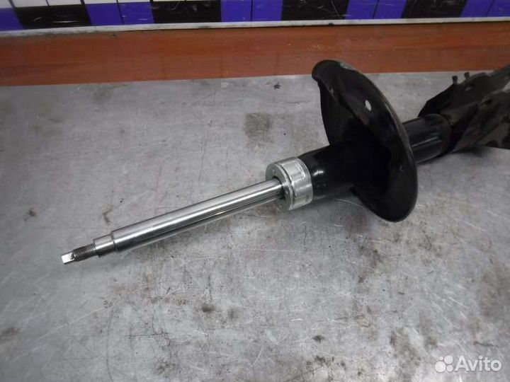 Амортизатор передний левый Mitsubishi Carisma