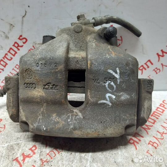 Суппорт тормозной передний левый Volkswagen Touran