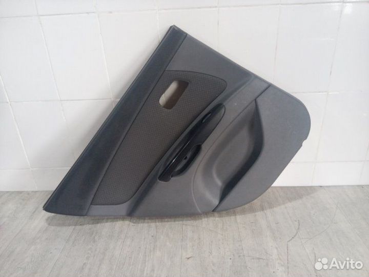 Обшивка двери задняя левая Kia Rio 2 2005-2011