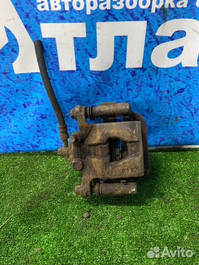 Суппорт тормозной задний левый Nissan Qashqai J10