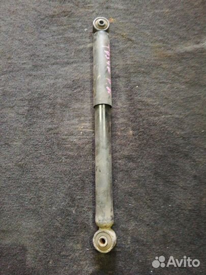 Стойка амортизатора задняя Suzuki Grand Vitara