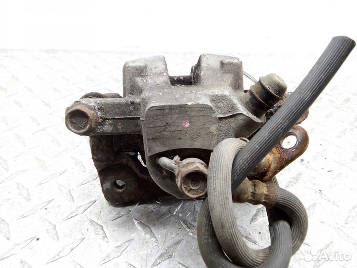 Суппорт задний левый Toyota Camry 6 XV40