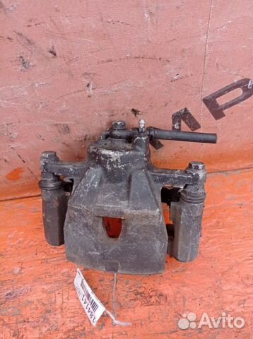 Суппорт передний левый Toyota Corolla Axio NZE141