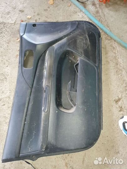 Обшивка двери водительская на лансер 9
