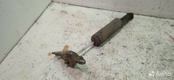 Амортизатор задний левый