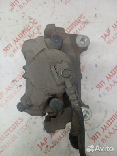 Суппорт тормозной передний левый Volkswagen Tiguan