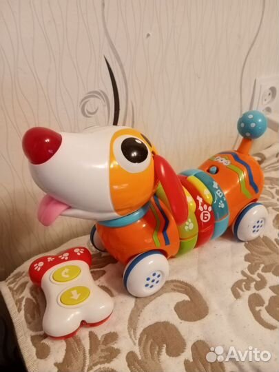 Собака каталка музыкальная