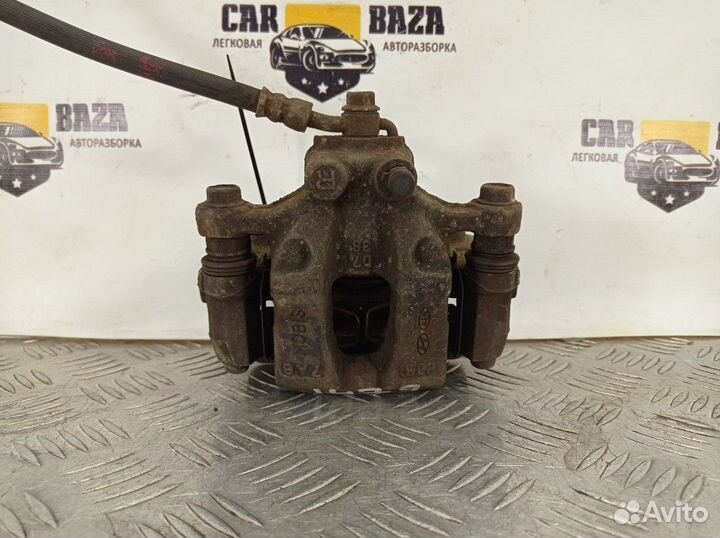 Суппорт тормозной задний правый R Hyundai Tucson