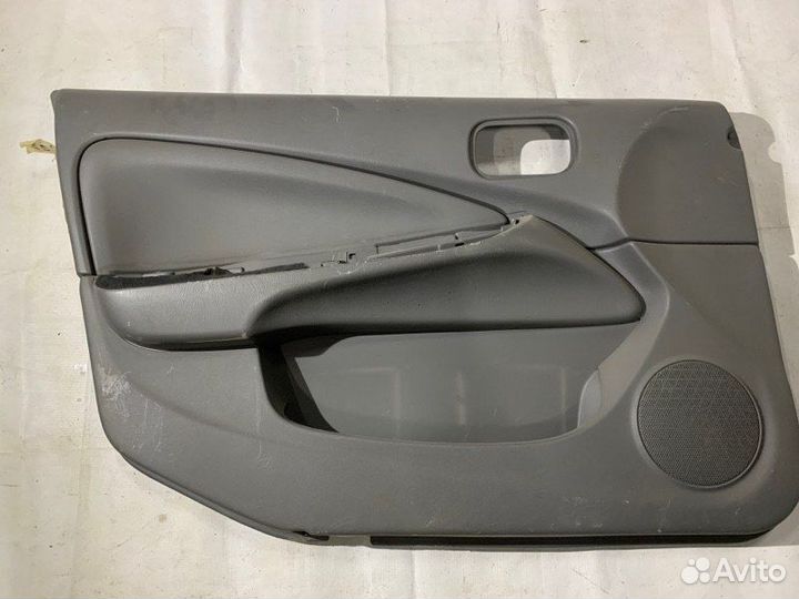 Обшивка двери передняя левая Nissan Almera Classic