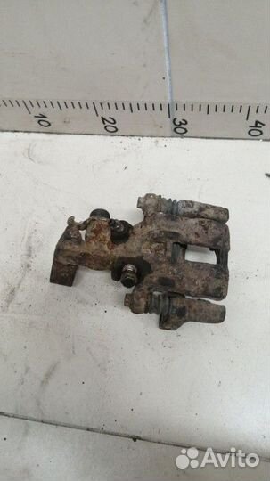 Суппорт задний правый Nissan Almera Tino