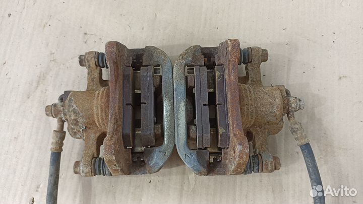 Суппорт тормозной правый левый Шевроле Лачетти