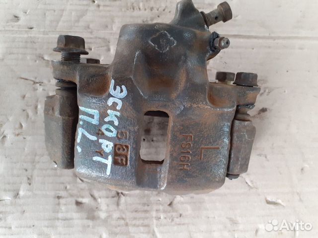 Суппорт тормозной передний левый Форд Эскорт