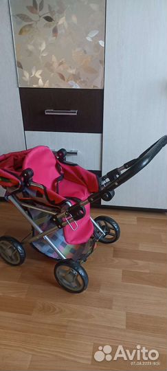 Детская игрушечная коляска