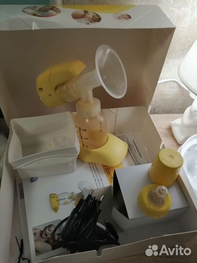 Молокоотсос medela электрический