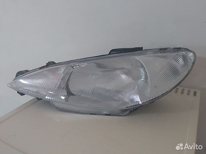 Фара левая peugeot 206