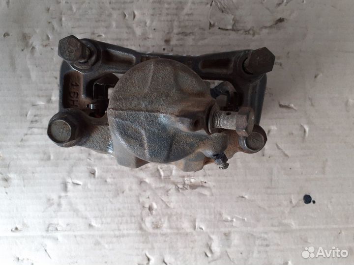 Суппорт тормозной передний левый Форд Эскорт