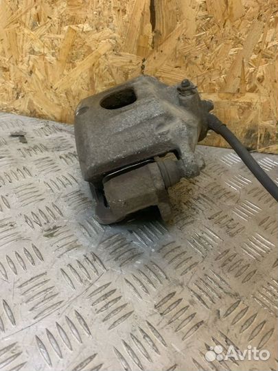 Суппорт тормозной передний левый Kia Cerato