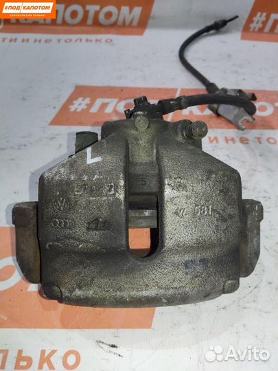 Суппорт тормозной передний левый Volkswagen Caddy