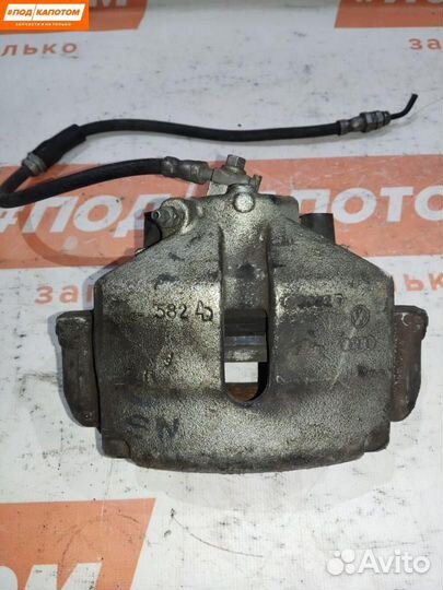 Суппорт тормозной передний правый Volkswagen Caddy