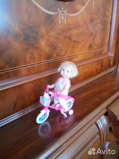Кукла с велосипедом