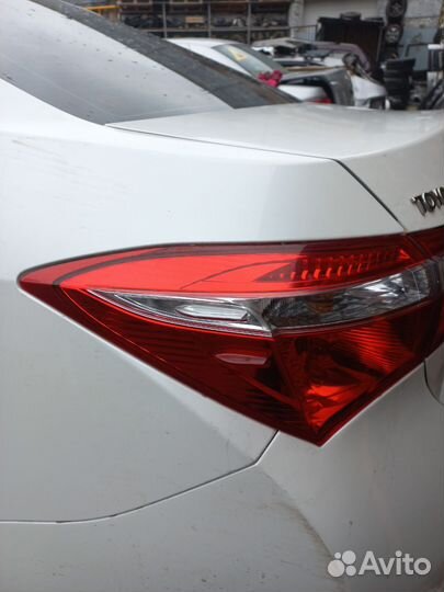 Фонарь левый наружний Toyota Corolla 180