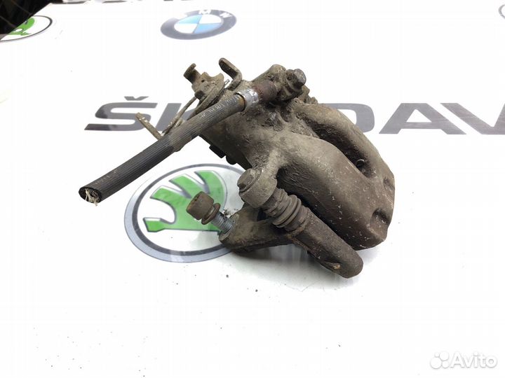 Суппорт тормозной задний левый Skoda Octavia A7