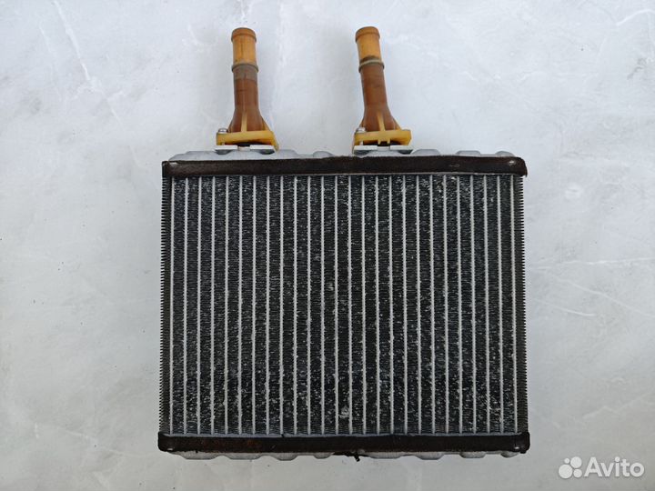 Радиатор печки Nissan Tino