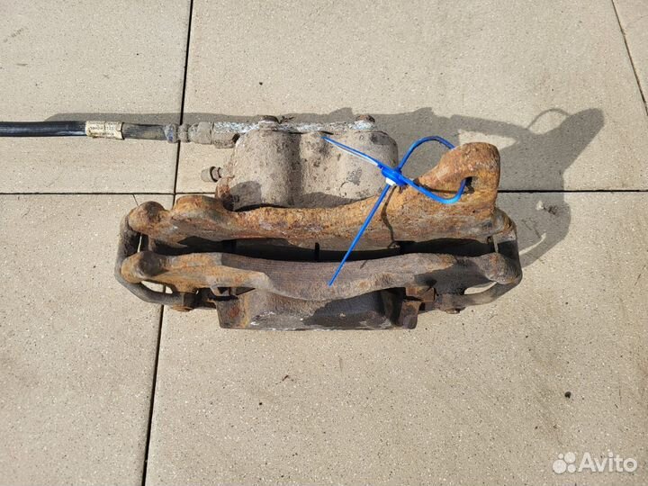 Тормозной суппорт перед лев Chevrolet Нива