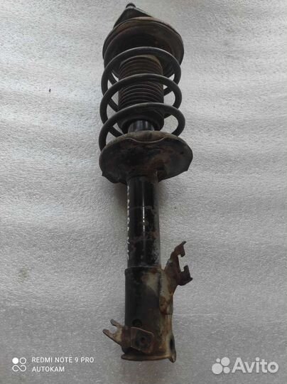 Стойка передняя левая Nissan Almera N15