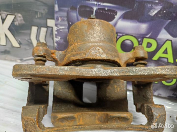 Суппорт передний Nissan Almera N15