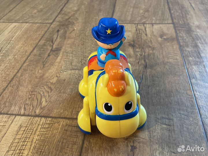 Tomy Игрушка музыкальная ковбой на лошадке