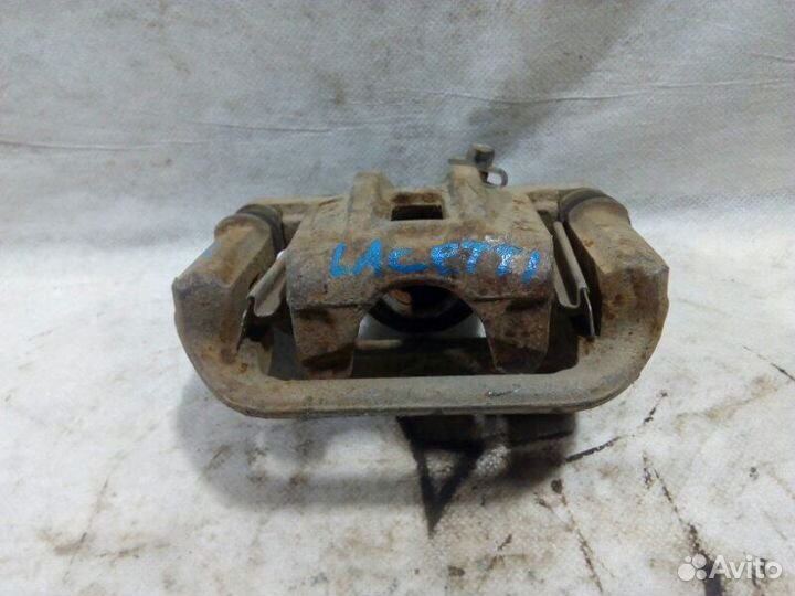 Суппорт передний передний правый Chevrolet Lacetti