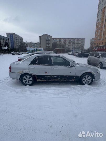 Mazda Familia 1.5 AT, 1999, 100 000 км