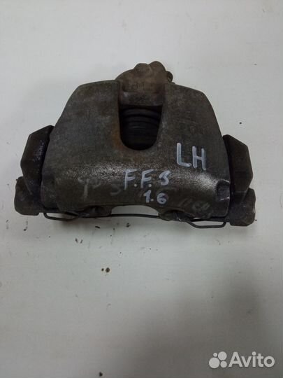 Суппорт тормозной передний левый Ford Focus 3