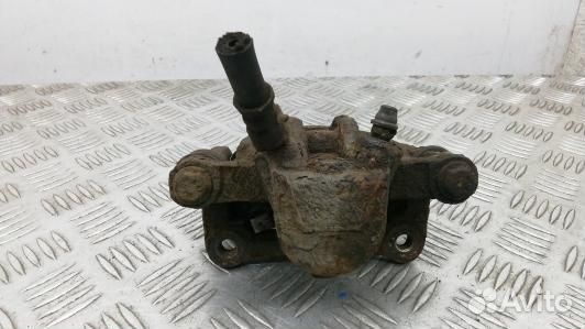 Суппорт тормозной задний левый toyota corolla E12