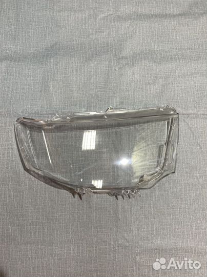 Новые Стёкла фар Mitsubishi Pajero Sport 2