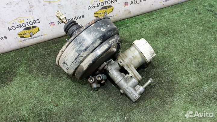 Вакуумник тормозной Mitsubishi Carisma I