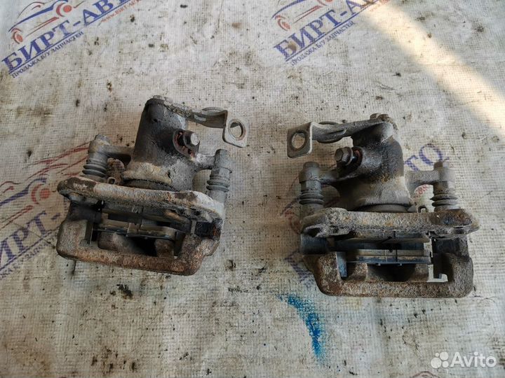 Суппорт тормозной задний левый Hyundai Solaris I