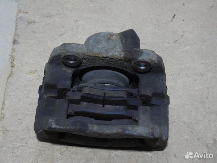 Суппорт тормозной передний левый Рено Логан