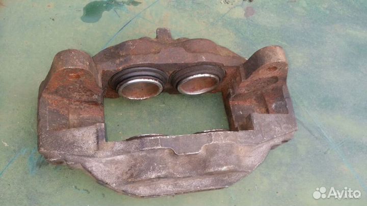 Суппорт тормозной передний левый ленд крузер 200