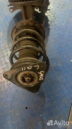 Стойка амортизатора перед. лев. Nissan Qashqai J11