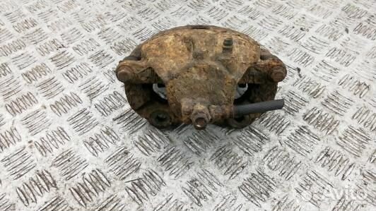 Суппорт тормозной передний правый nissan primera P12 (64Z04N701)