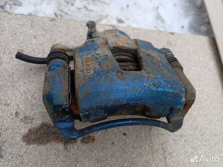 Суппорт тормозной передний Chevrolet Lacetti